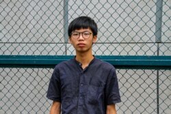 FILE - Tony Chung was found guilty of unlawful assembly and desecrating the national flag. He will be sentenced on Dec. 29, 2020. Photo taken in Mongkok, Hong Kong, Oct. 2020. (Tommy Walker/VOA)