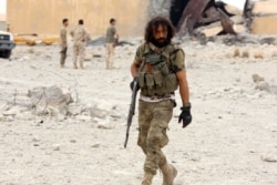 A member of Libya's internationally recognized government after taking control of al-Watiya airbase, May 18, 2020.