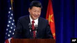 Presiden China Xi Jinping berbicara dalam sebuah acara di Seattle, Washington dalam lawatannya ke AS (22/9).