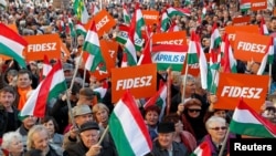 Supporters of Hungarian Prime Minister Viktor Orban are seen before his campaign closing rally in Szekesfehervar, Hungary, April 6, 2018. 