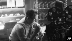 In this image released by Netflix, Gary Oldman portrays Herman Mankiewicz in a scene from "Mank."