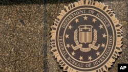 FILE - The seal on the J. Edgar Hoover FBI Building is seen June 9, 2023, in Washington. 