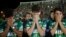 Chapecoense soccer players who did not travel with their team on a flight to Colombia that crashed, mourn during a tribute to the crash victims at Arena Condado stadium in Chapeco, Brazil, Nov. 30, 2016.