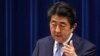 FILE - Japan's Prime Minister Shinzo Abe answers a question from a journalist during a press conference at the prime minister's official residence in Tokyo, July 20, 2018. 