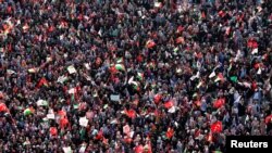 People wave Turkish and Palestinian flags during a protest against Israel, in Istanbul, Turkey, July 30, 2017.