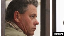 FILE - Theo Bronkhorst faces trial Sept. 28 on charges of breaching hunting rules by helping an American dentist kill Cecil the lion outside the Hwange wildlife park. 