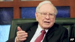 FILE - Berkshire Hathaway Chairman and CEO Warren Buffett speaks during an interview with Liz Claman on the Fox Business Network in Omaha, Neb.