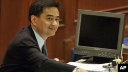 Thai Prime Minister Abhisit Vejjajiva takes his seat at parliament for a no-confidence debate, March 15, 2011 in Bangkok, Thailand