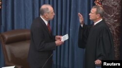 Senator Chuck Grassley (R-IA), the president pro tempore of the U.S. Senate, swears in Chief Justice of the United States John Roberts to preside over the Senate impeachment trial of U.S. President Donald Trump January 16, 2020. (REUTERS/U.S. Senate TV/Handout via Reuters)