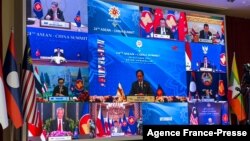 Sultan of Brunei Hassanal Bolkiah (C) takes part in the ASEAN-China Summit on the sidelines of the 2021 Association of Southeast Asian Nations (ASEAN) summits held online on a live video conference in Bandar Seri Begawan, Brunei, Oct. 26, 2021. 