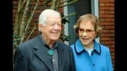 In this image from video, former President Jimmy Carter and former first lady Rosalynn Carter, seen in a photo as they speak on audio only, during the second night of the Democratic National Convention on Aug. 18, 2020.