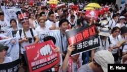 Many protesters call for Chief Executive Carrie Lam’s resignation in Hong Kong, June 9, 2019, at a demonstration against extradition to China. 