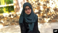 Salgai Baran, who received the highest the highest score in the entire country on Afghanistan's university entrance exams this year, poses for photograph at her home in Kabul, Afghanistan, Aug. 26, 2021.