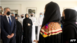 US Secretary of State Antony Blinken (L) and Qatar’s assistant Foreign Minister Lolwah al-Khater (3rd L) meet with Afghan all-female robotics team members at Qatar's Education City Club House in Doha on September 7, 2021. 