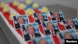 ภาพจากวิดีโอของรอยเตอร์ ที่เป็นหน้าเค้ก "Trump slices" ในเยอรมนี (Reuters)