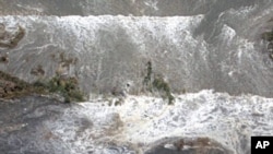 Houses are damaged by water following a tsunami and earthquake in Ibaraki city, Ibaraki Prefecture, Mar 11 2011