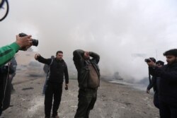 A man wails after a government airstrike in the city of Idlib, Syria, Feb. 11, 2020.