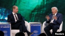 FILE - Britain's Prince William, Duke of Cambridge interviews naturalist Sir David Attenborough during the World Economic Forum (WEF) annual meeting in Davos, Switzerland, Jan. 22, 2019. 