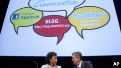 Rep. Barbara Lee, D-Calif., left talks with former Senate Majority Leader Bill Frist before a session at the XIX International AIDS Conference in Washington, July 25, 2012.