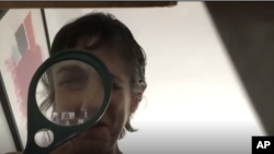 In this May 11, 2020, image made from video provided by Greenwich House, a woman participates in an online comedy class through Greenwich House in New York. (Courtesy of Celeste Kaufman/Greenwich House via AP)