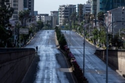 FILE - Roads in the capital lie empty after they were closed to be disinfected to halt the spread of the new coronavirus, in Addis Ababa, Ethiopia, March 29, 2020.