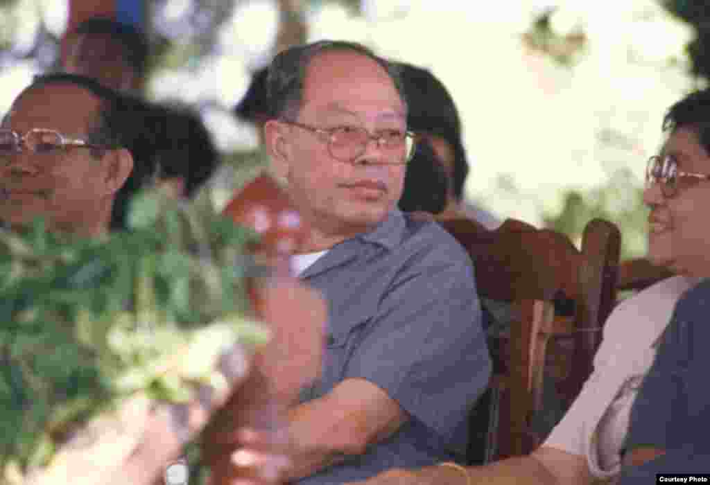 Ieng Sary sits next to his wife during his defection ceremony, Pailin, Cambodia, November, 1996. (Youk Chhang/Documentation Center of Cambodia Archive)