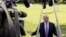FILE - President Donald Trump speaks to the media as he walks across the South Lawn of the White House in Washington, Sept. 29, 2017.