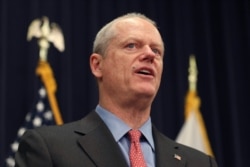 Massachusetts Gov. Charlie Baker announces that a state of emergency would go into effect during an update on coronavirus preparedness and planning at the Statehouse in Boston, March 10, 2020.