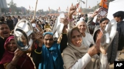 Supporters of India's main opposition National Democratic Alliance protest in the capital, New Delhi, Dec. 22, 2010.