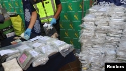 Police display a portion of the six tons of cocaine, money and other material which was seized during a drug bust at an industrial estate at the police headquarters in Malaga, Spain, Oct. 25, 2018. 