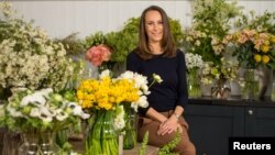 Florist Philippa Craddock, who has been chosen to create the floral displays for the wedding of Prince Harry and Meghan Markle, poses for a photograph in her studio in London, March 29, 2018.