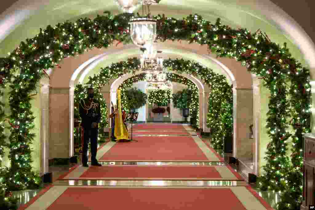 The Center Hall of the White House is decorated for the holiday season during a press event for the White House holiday decorations, Monday, Nov. 29, 2021, in Washington. (AP Photo/Evan Vucci)