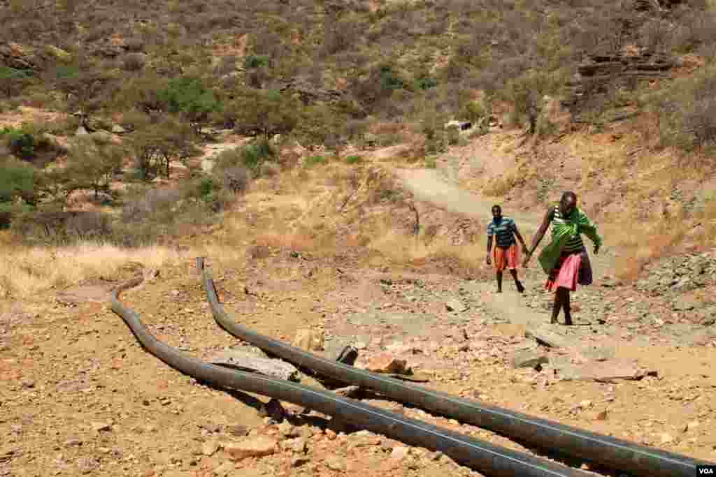 Water pipes laid by a large mining company conducting exploration in Karamoja, Uganda, March 2, 2014. (Hilary Heuler for VOA)