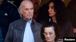 FILE - Convicted former Nazi SS captain Erich Priebke (L) leaves after attending a mass at a church in northern Rome, Italy.