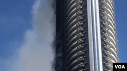 A view of the Address Hotel the morning after the fire, Jan. 1, 2016. (M. Besheer/VOA)
