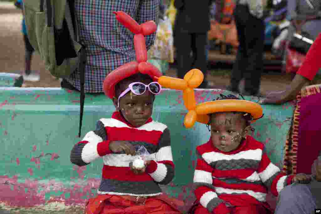 Kenyan children enjoy as families gather at Uhuru Park, Nairobi, Kenya, Jan. 1, 2017, to celebrate New Year.