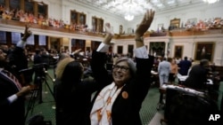 Democratic members cheer as the Texas Senate tries to bring an abortion bill to a vote as time expires, in Austin, Texas, June 26, 2013.