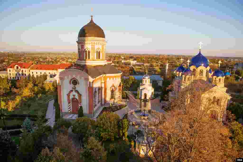 Viewed from halfway up Moldova's highest bell tower, the 19th century Noul Neamt Monastery glows in the late afternoon autumn sun of Kitskani. (Vera Undritz for VOA)