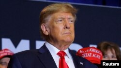 FILE - Former U.S. President and Republican presidential candidate Donald Trump attends a campaign event in Manchester, New Hampshire, April 27, 2023. 