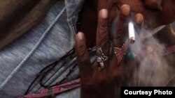 A woman smokes a cigarette in Washington, D.C.