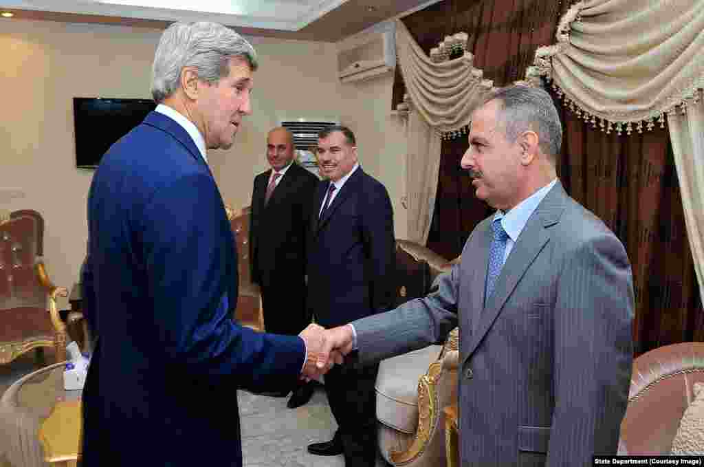 Secretary Kerry is Greeted by Media Adviser to Iraqi Council of Representatives Speaker Nujaifi in Baghdad.