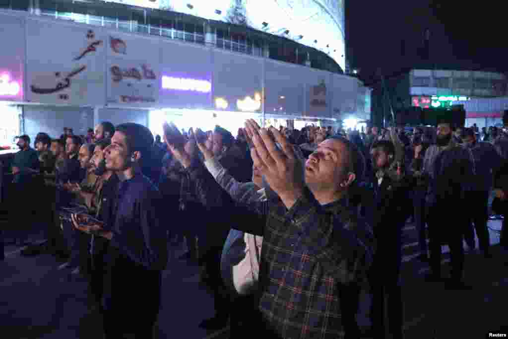 People pray for the well-being of Iran&#39;s President Ebrahim Raisi following the crash of a helicopter carrying him, in Tehran, May 19, 2024. (Majid Asgaripour/WANA (West Asia News Agency))