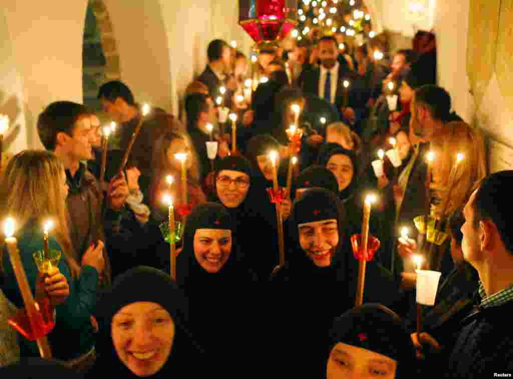 Orthodox nuns attend the Christian Orthodox Easter service at the 10th century St. John the Baptist Monastery near Mavrovo, west of Macedonia's capital Skopje, April 16, 2017. 