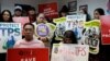 FILE - People gather during a news conference at the New York Immigration Coalition following U.S. President Donald Trump's announcement to end the Temporary Protection Status for Salvadoran immigrants in Manhattan, New York, Jan. 8, 2018.