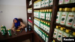 Refqa Al-Hamalawi, chairman of the board of the Najd Development Forum sits in her office in Gaza City July 28, 2021. (REUTERS/Mohammed Salem)
