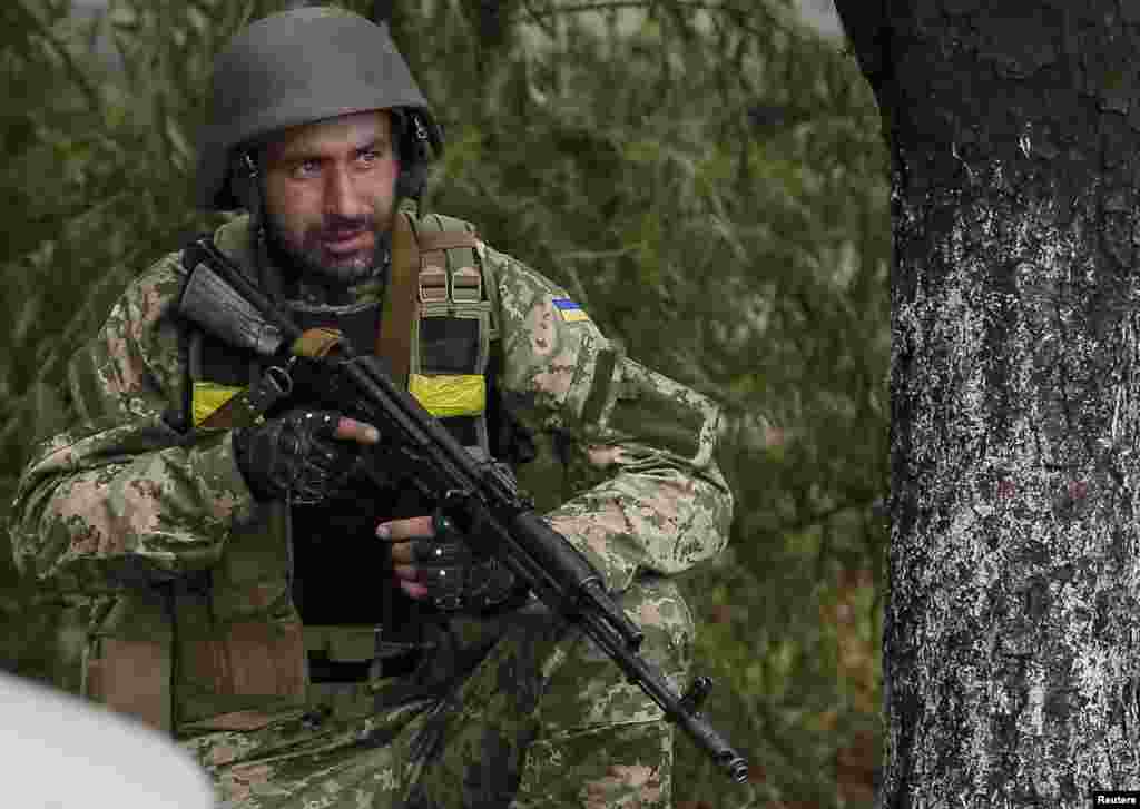 A Ukrainian serviceman takes his position in Debaltseve, Ukraine, Sept. 9, 2014.