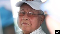 In this photo taken, July 26, 2013, Chea Sim President ruling of of Cambodian People's Party Chea Sim and Senate President, is seen at the final campaign for the July 28 general election, in Phnom Penh, Cambodia. 