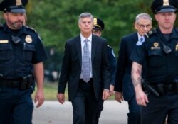 Ambassador William Taylor, is escorted by U.S. Capitol Police as he arrives to testify before House committees as part of the Democrats' impeachment investigation of President Donald Trump, at the Capitol in Washington, Oct. 22, 2019.