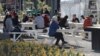 Patrons enjoy lunch at a market in Christchurch, New Zealand, Aug. 9, 2020, as the country marked 100 days of being free from the coronavirus, with just a few infections continuing to be picked up at ports of entry where people are quarantined.