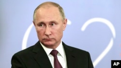 FILE- Russian President Vladimir Putin speaks to the media after the G-20 summit in Buenos Aires, Argentina, Dec. 1, 2018.